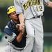 Michigan catcher, sophomore Cole Martin collides with pitcher, freshman James Bourque at Eastern on Wednesday.  Melanie Maxwell I AnnArbor.com